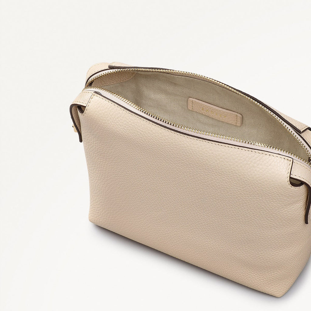Eastcastle Street Leather Mini Ziptop Crossbody Bag in Oat Milk - 111211