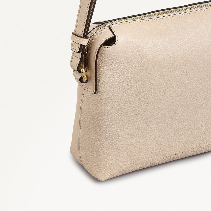 Eastcastle Street Leather Mini Ziptop Crossbody Bag in Oat Milk - 111211