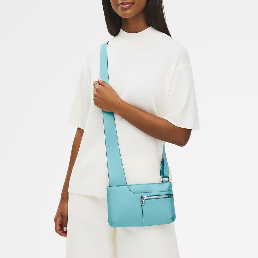 Pockets Leather Mini Ziptop Cross Body Bag in Maldives - 111448