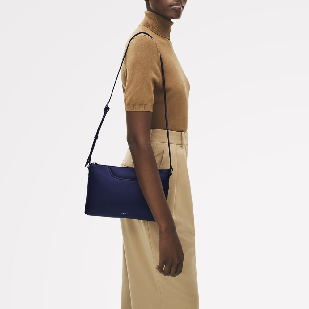 Pockets Leather Medium Ziptop EW Cross Body Bag in Evenfall - 112149