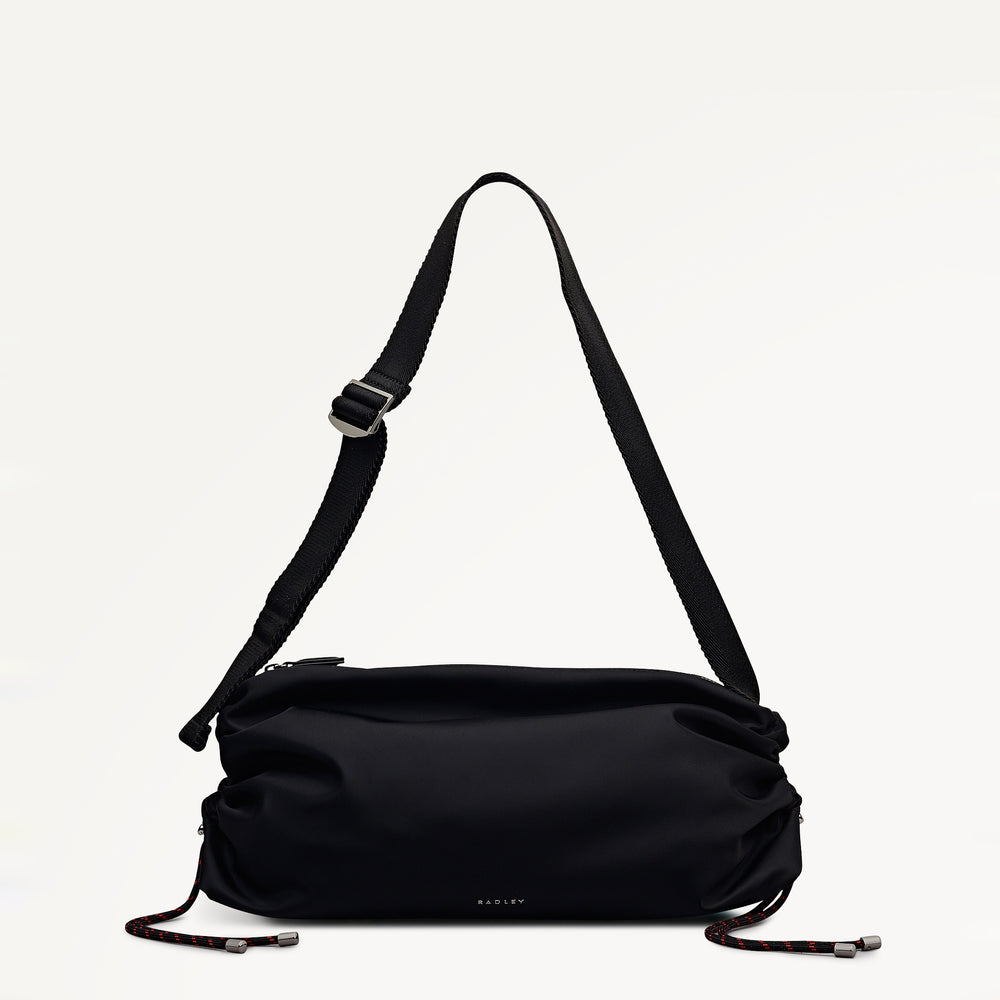 Black shoulder bag with a strap on a white background