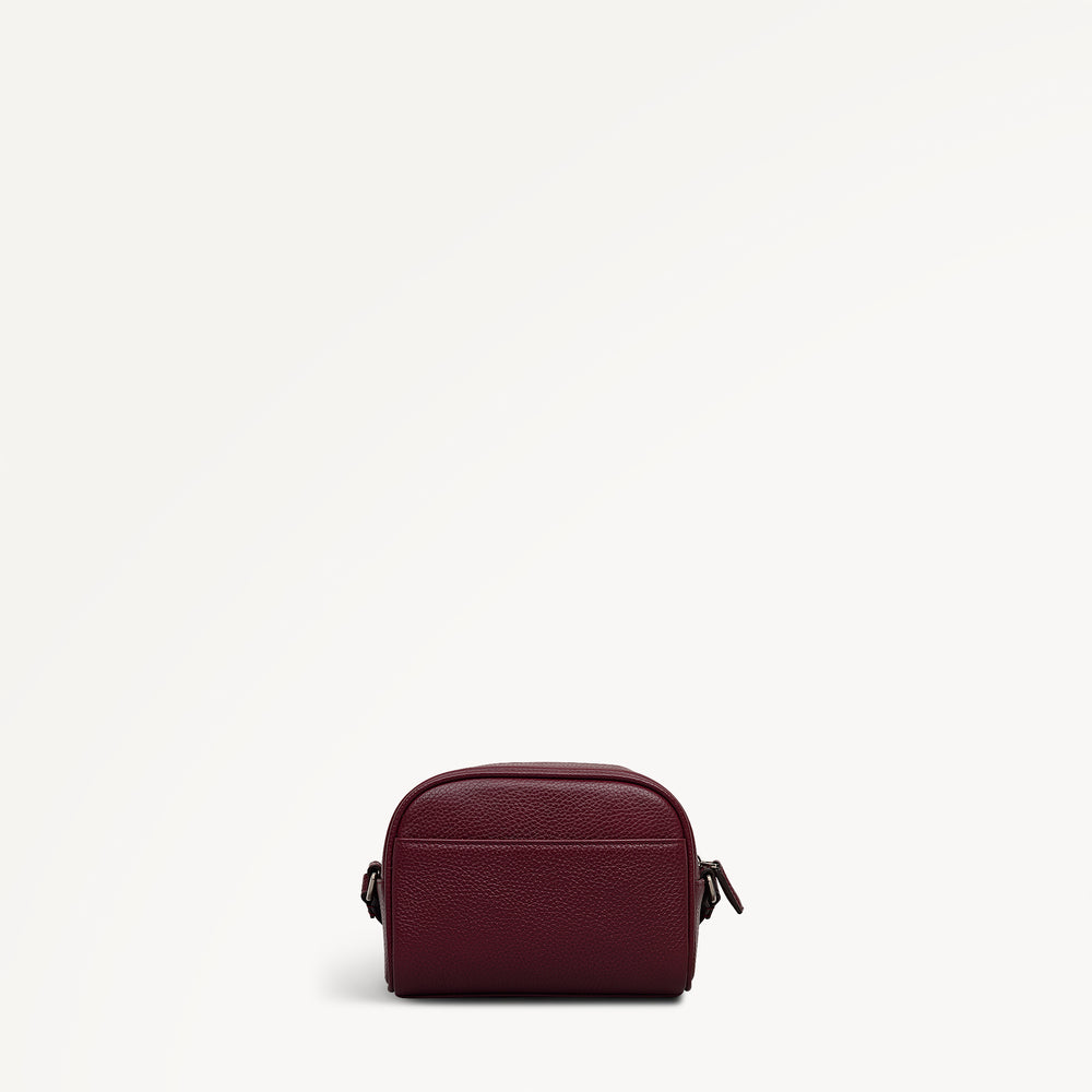 THE DAILY SMALL ZIP AROUND CROSS BODY DARK CHERRY