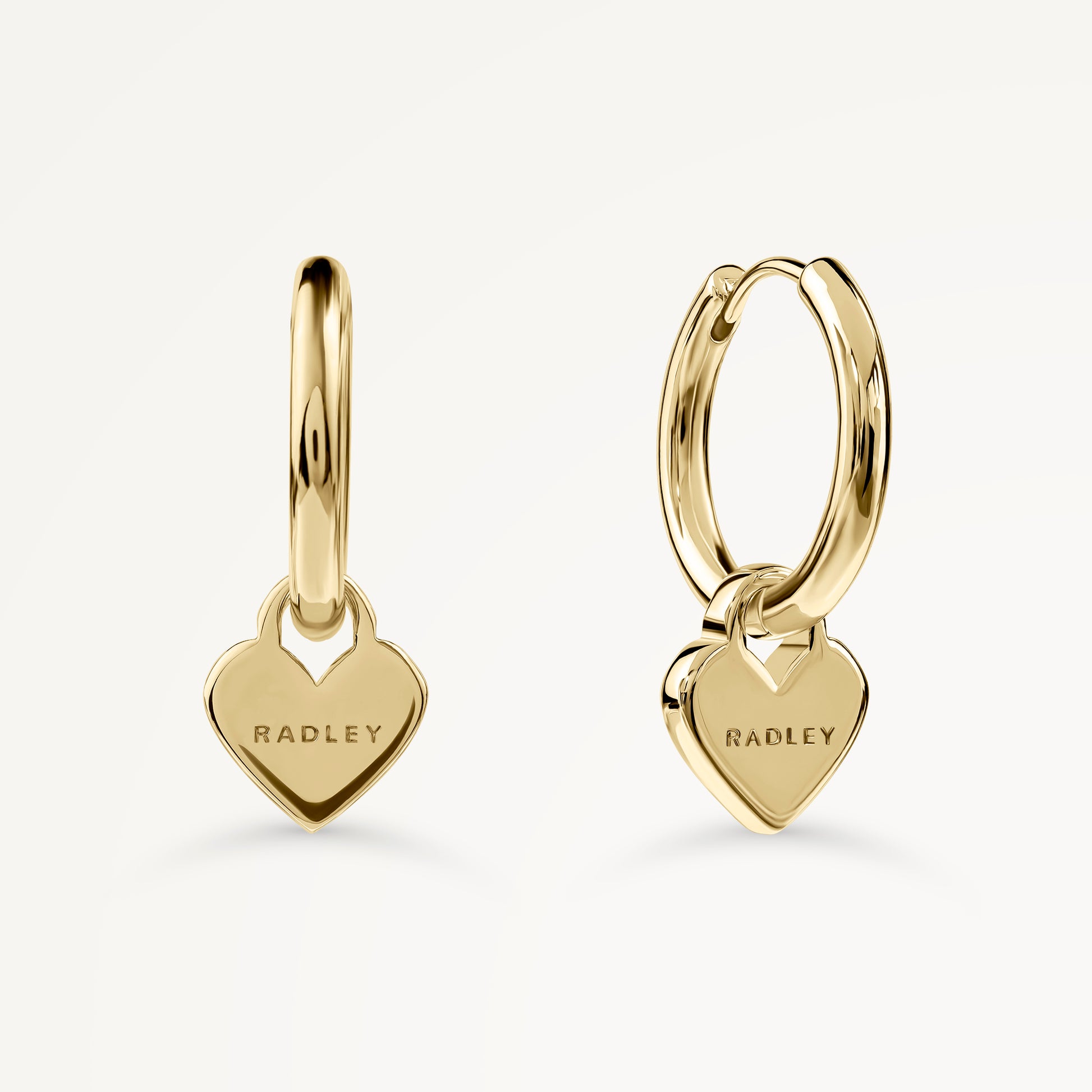 SELSEY STREET HANGING HEART HUGGIE EARRINGS GOLD