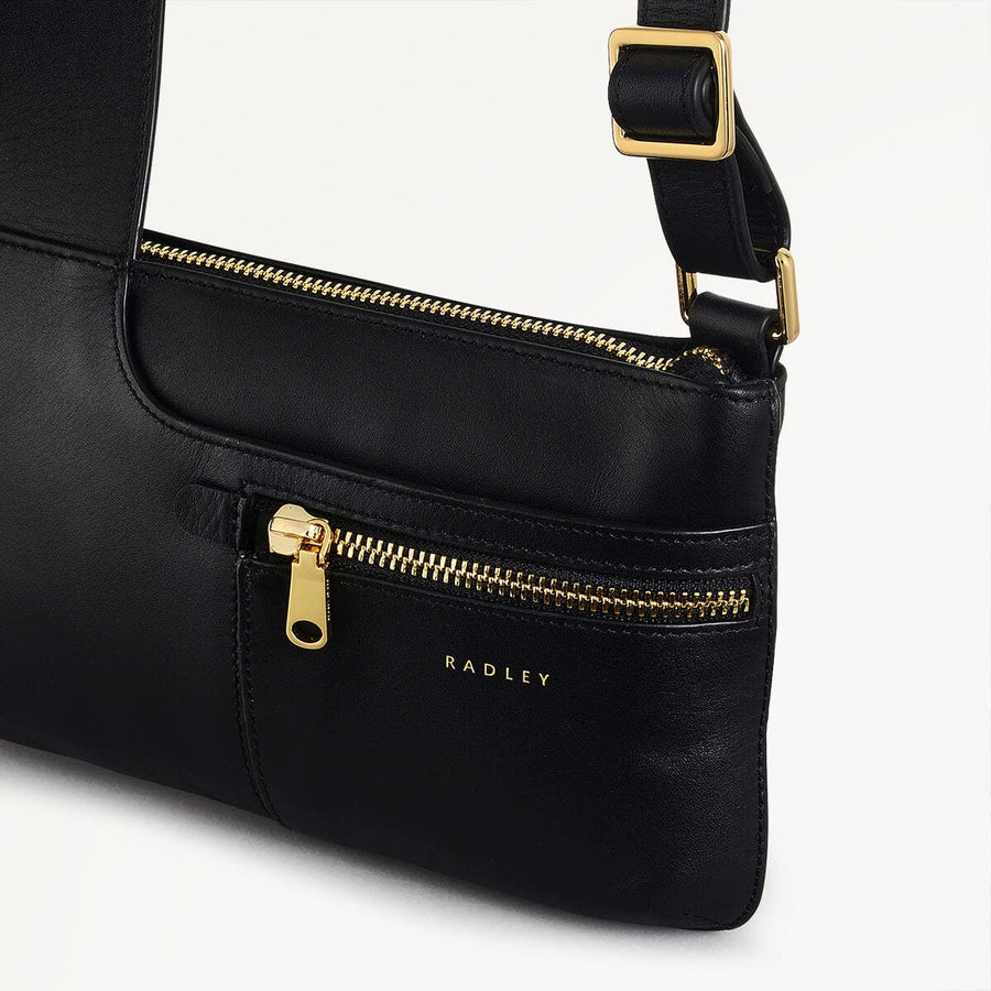 Pockets Leather Mini Ziptop Crossbody Bag in Black - H8848001