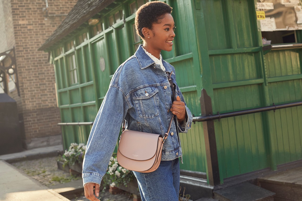 Cross over bag outlet