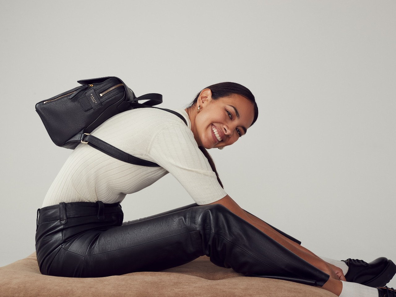 Model with Lorne Close leather backpack