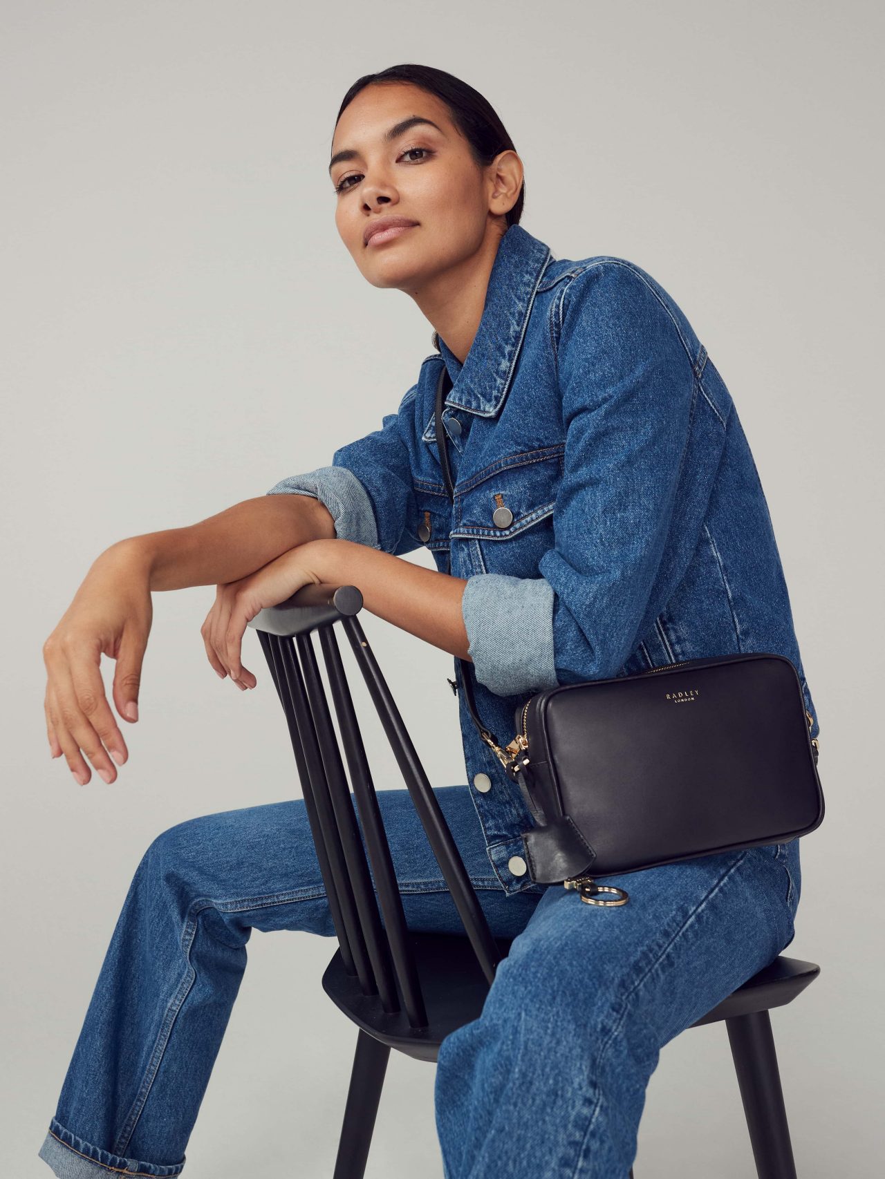 Model with Manor Grove leather crossbody handbag
